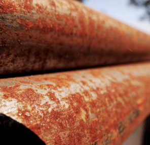 corrosion riddent rusty metal pipe 